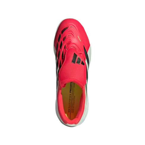 Top-down view of a vibrant pink and black Adidas Predator soccer cleat with a yellow insole, isolated against a solid black background.