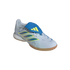 A side-angle view of an Adidas Predator indoor soccer shoe against a black background. The shoe features a light grey textured upper with three iridescent blue stripes outlined in yellow, a prominent blue fold-over tongue with a yellow Adidas logo, and a