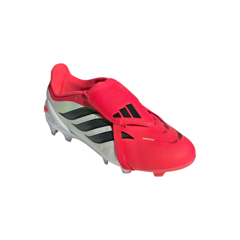 An Adidas Predator soccer cleat in red and white with black stripes and a fold-over tongue.
