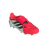 An Adidas Predator soccer cleat in red and white with black stripes and a fold-over tongue.