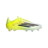 Side profile of a neon yellow and white Adidas soccer cleat with black stripes and translucent studs, isolated against a black background.