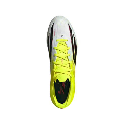 Top-down view of a white and neon yellow Adidas soccer cleat with bright yellow laces on a black background.