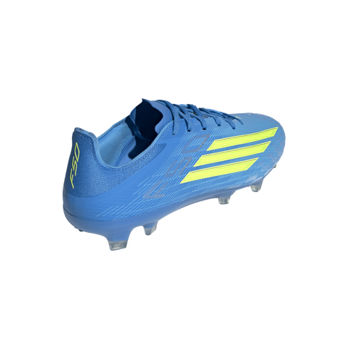 A blue soccer cleat with lime green accents and clear studs, shown from a rear-quarter perspective against a solid black background.