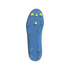 A bottom-up view of the light blue sole of a soccer cleat, featuring four yellow studs at the toe and several translucent blue studs around the edges. The Adidas logo is embossed in the center of the front half. Long, curved ridges run the length of the s
