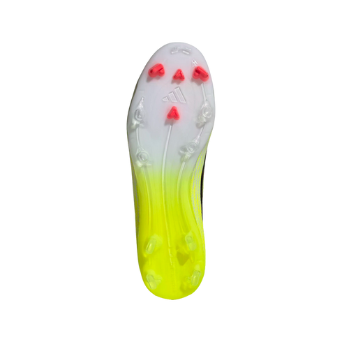 Bottom view of an Adidas soccer cleat soleplate with a white to neon yellow gradient and red triangular studs on the forefoot.