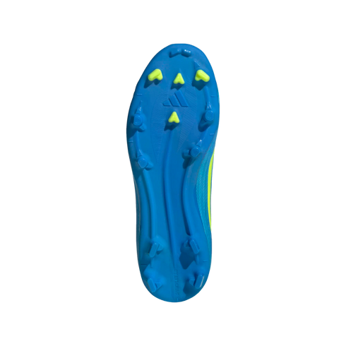 A bottom-up view of a bright blue soccer cleat soleplate with lime green chevron-shaped studs and the Adidas logo, centered against a black background.