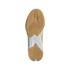Bottom view of a tan and white Adidas athletic shoe sole with textured gum rubber tread on a black background.