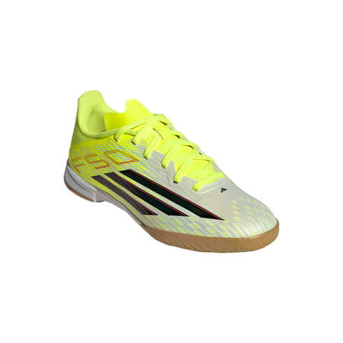 A neon yellow and white Adidas F50 indoor soccer shoe featuring black stripes and a gum rubber sole, shown at an angle against a black background.