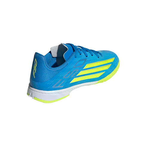 A bright blue Adidas F50 athletic shoe with lime green stripes and accents, featuring a white midsole and shown from a rear-three-quarter angle against a solid black background.