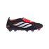Side profile of a black Adidas Predator soccer cleat with three white stripes and a red fold-over tongue.