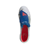 Top-down view of a white Adidas soccer cleat featuring a blue fold-over tongue with red stripes and a red insole with a cursive signature.