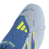 A close-up view of a light blue and blue Adidas Predator soccer cleat. The shoe features a blue fold-over tongue with neon yellow Adidas stripes and the text "EST. 1994" at its base. The light blue textured upper includes the text "NANOSTRIKE+" and a stra
