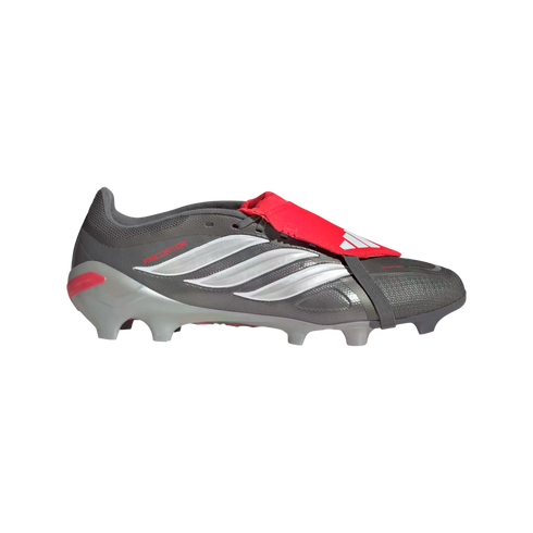 A grey Adidas Predator football boot with three white stripes and a red fold-over tongue, shown in a side profile on a black background.