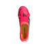 Top-down view of a bright pink Adidas Predator soccer cleat with black accents and a yellow insole, isolated on a black background.