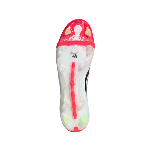 The bottom of a white Adidas soccer cleat with pink and lime green accents, showcasing the stud pattern and power spine on a black background.