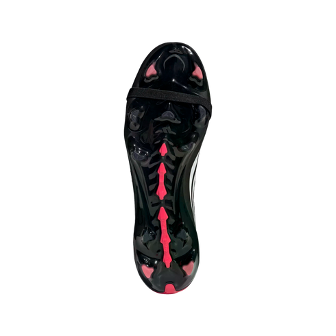 The glossy black outsole of a soccer cleat, featuring bright pink studs and a pink central spine design with a black elastic strap across the midfoot.