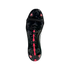 The glossy black outsole of a soccer cleat, featuring bright pink studs and a pink central spine design with a black elastic strap across the midfoot.