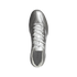 A top-down view of a metallic silver Adidas Copa soccer cleat with white laces, centered against a solid black background.
