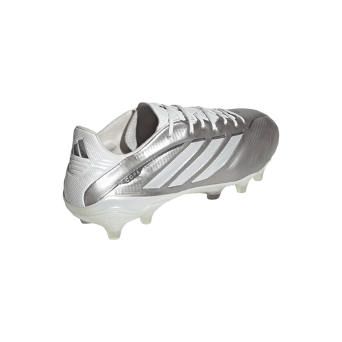 A rear three-quarter view of a metallic silver and white Adidas Copa soccer cleat with white laces and clear studs against a solid black background.