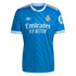 Bright blue Real Madrid soccer jersey with white Adidas trefoil logo, club crest, and "Emirates FLY BETTER" sponsor across the chest.