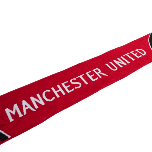 Red Manchester United scarf with white block lettering on a white background.