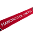 Red Manchester United scarf with white block lettering on a white background.