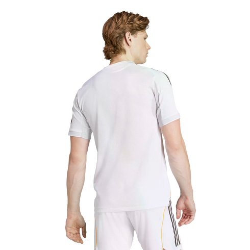 Rear view of a man with light brown hair wearing a white athletic t-shirt and white shorts with black stripes, isolated on a white background.