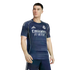 Male model wearing a navy blue Real Madrid soccer jersey with white sponsor text and light green piping against a white background.