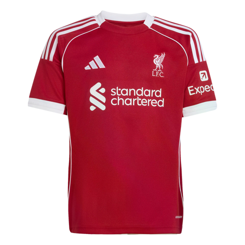 Red Liverpool FC home jersey with white Adidas stripes on shoulders, club crest, and Standard Chartered sponsor logo. White trim on the collar, sleeves, and sides.