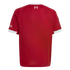 The back of a red football jersey with white trim on the collar and sleeves. A small white "97" memorial logo with flames is at the neck.