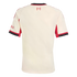 Back of a cream-colored soccer jersey with red and black trim. Features a '97' flame emblem on the upper back and red sleeve details, displayed on a black background.
