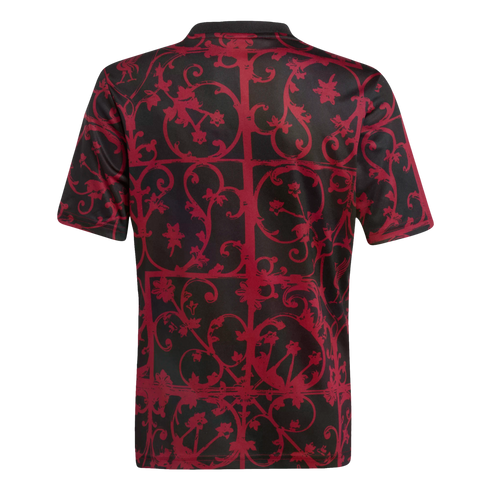 Back view of a black short-sleeved t-shirt featuring a dark red, ornate scrollwork pattern in a grid layout, set against a solid black background.