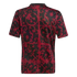 Back view of a black short-sleeved t-shirt featuring a dark red, ornate scrollwork pattern in a grid layout, set against a solid black background.