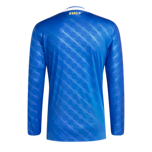 Rear view of a royal blue long-sleeved jersey with subtle diagonal stripes and "RMCF" printed in yellow on the back neck.