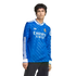 Man wearing a blue long-sleeved Real Madrid soccer jersey with white trim and Emirates sponsor logo.