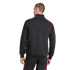 Rear view of a man wearing a black tracksuit with red stripes along the shoulders and pants, standing against a solid black background.