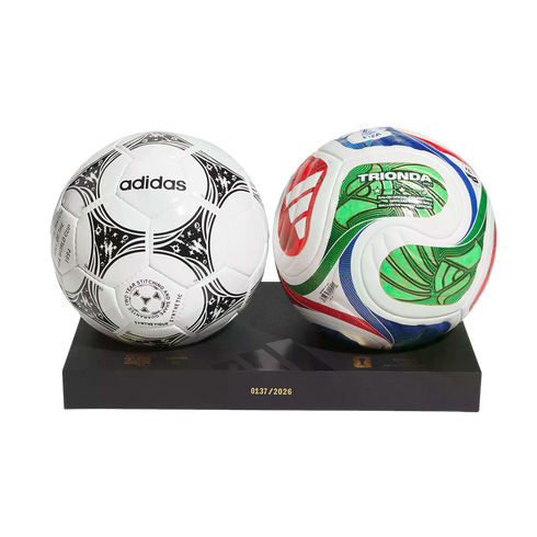 Two soccer balls on a black stand: a classic white Adidas Questra on the left and a colorful, modern Trionda on the right. The stand features the number 0137/2026.