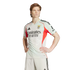 Man wearing a light grey and red SL Benfica soccer kit, standing with hands on hips against a white background.