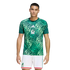 Male model wearing a Mexico national football team kit by Adidas, featuring a green geometric patterned jersey and white shorts.