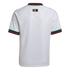 Back view of a white soccer jersey with green and red accents on the collar and cuffs. A small "Somos México" logo is centered on the upper back.