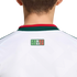 Back view of a white sports jersey with a green and red collar. A small logo below the collar reads "SOMOS MÉXICO" in stylized lettering with the colors of the Mexican flag.