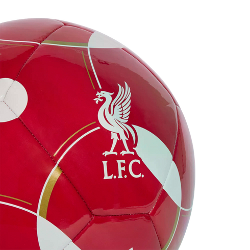 A glossy red soccer ball featuring the white Liverpool FC crest and decorative gold and white curved patterns.