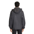 Back view of a person wearing a dark grey hooded jacket with white stripes on the sleeves and black pants, against a plain light grey background.