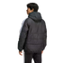 Rear view of a man wearing a black hooded puffer jacket and matching pants with white stripes, standing against a solid black background.