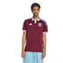 A man models a maroon and light-blue Adidas soccer jersey with a polo collar and a lion crest on the chest, standing against a white background.