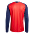 The back view of a red long-sleeved sports jersey with dark blue sleeves and thin vertical yellow stripes. A small gold "España" label is on the back of the neck.