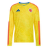 Yellow long-sleeved Colombia soccer jersey with tonal butterfly pattern, red shoulder and sleeve stripes, blue Adidas logo, and team crest on the chest.