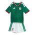 Mexico national football team kit with a green Aztec-patterned jersey and white shorts on a black background.