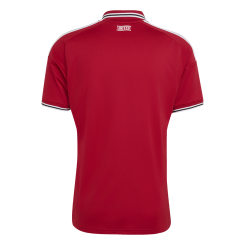 Rear view of a red short-sleeved jersey with white shoulder stripes and a striped collar featuring the word "UNITED" on the back neck.