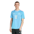 A man models a light blue Inter Miami CF soccer jersey with pink accents and black Adidas pants against a white background.